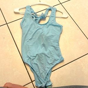 Blue body suit with open back